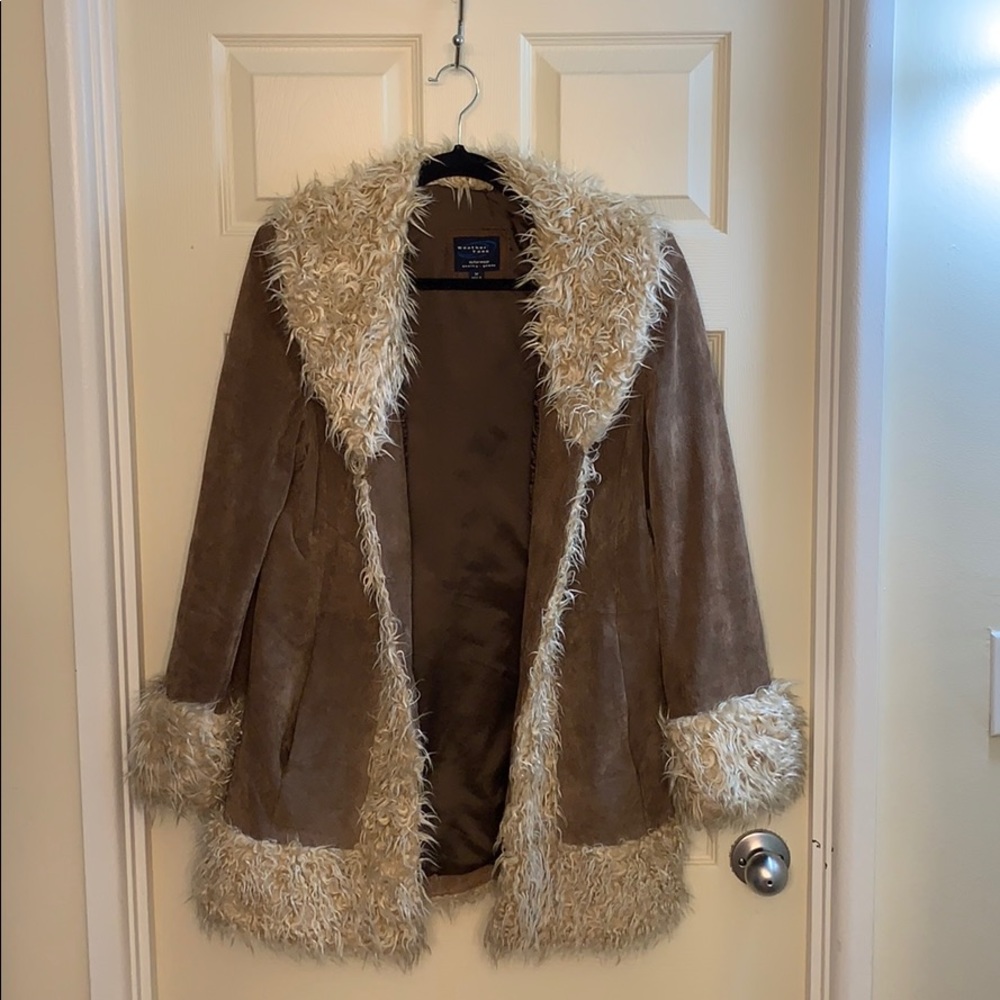 Leather coat with fur accents.